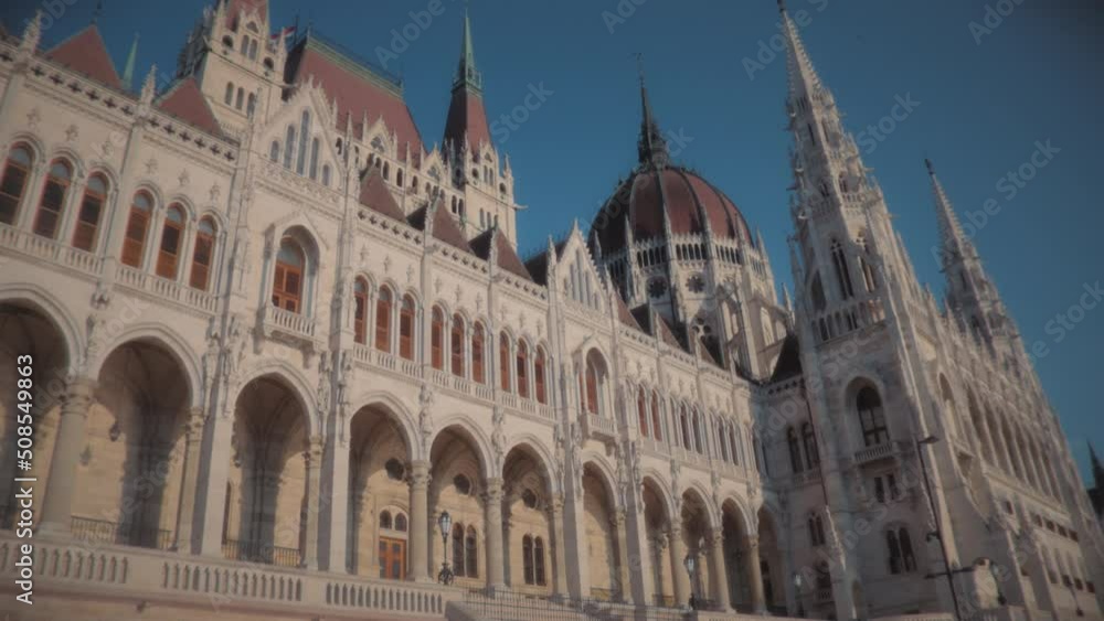 Beautiful Hungarian Parliament building, low angle view. Slow motion. Beautiful Hungarian Parliament building, low angle view. Slow motion.