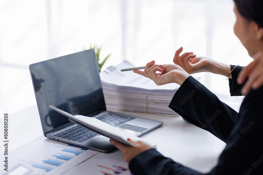 Team of Asian Businessman working at office with documents on his desk, doing planning analyzing the financial report, business plan investment, finance analysis concept