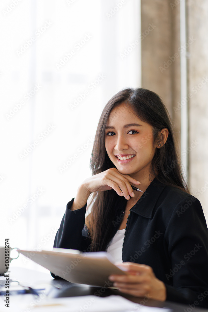 Financial Asian Businesswomen analyze the graph of the company's performance to create profits and growth, Market research reports and income statistics, Financial and Accounting concept. Financial Asian Businesswomen analyze the graph of the company's performance to create profits and growth, Market research reports and income statistics, Financial and Accounting concept.