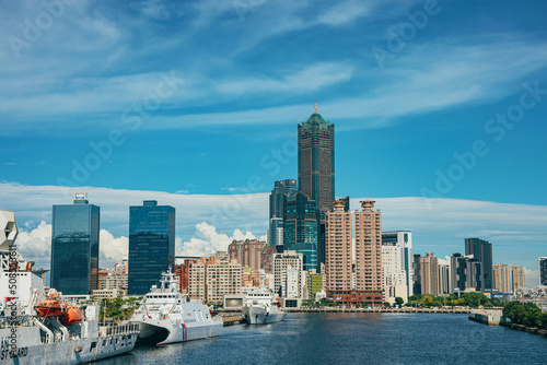 Kaohsiung, Taiwan- May 11, 2022: Pier-2 Art Center’s installation art with the famous landmark 85 Sky Tower and Kaohsiung Music Center background in the port of Kaohsiung, Taiwan. photo