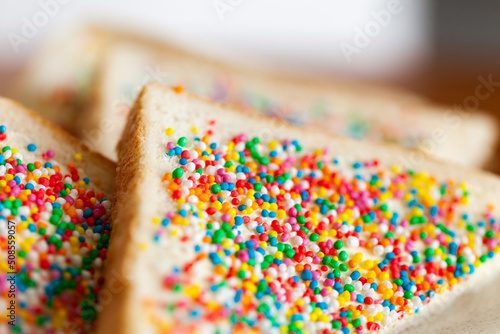 Colourful sprinkles on fairy bread close up photo