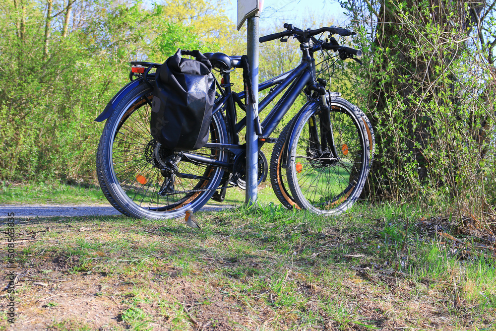 Regensburg, Germany:  two bicycles parked on a rural road
