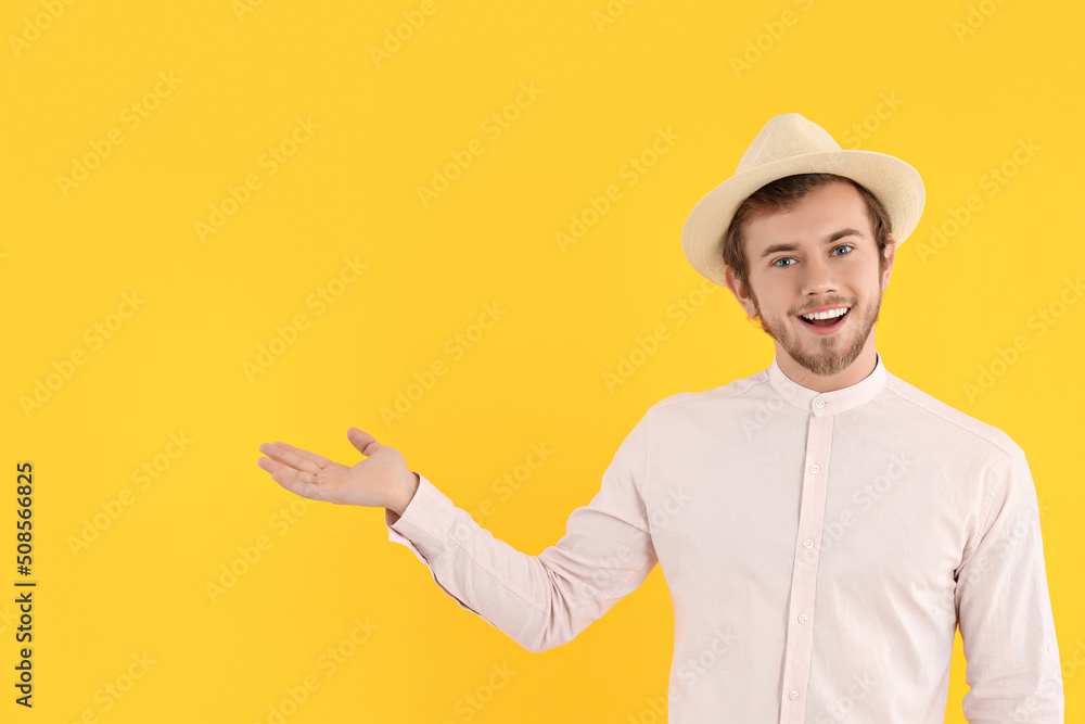 Concept of people, young man on yellow background Concept of people, young man on yellow background