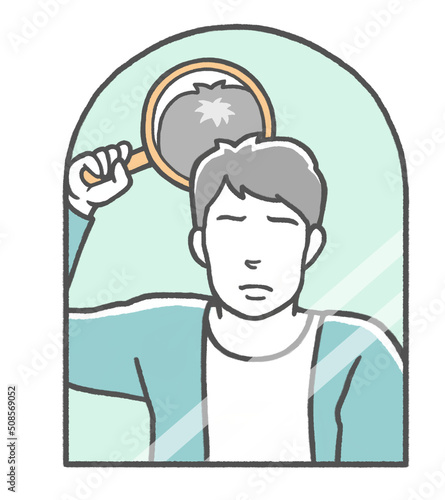 合わせ鏡をして頭頂部の薄毛に悩む若い男性