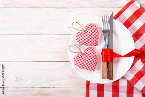 Obraz na płótnie Valentine handmade fabric hearts in plate for romantic dinner flat lay with copy-space background on white wooden table w salonie
