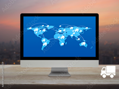 Delivery truck icon with connection line and world map on computer screen on table over blur of cityscape on warm light sundown, Transportation online concept, Elements of this image furnished by NASA