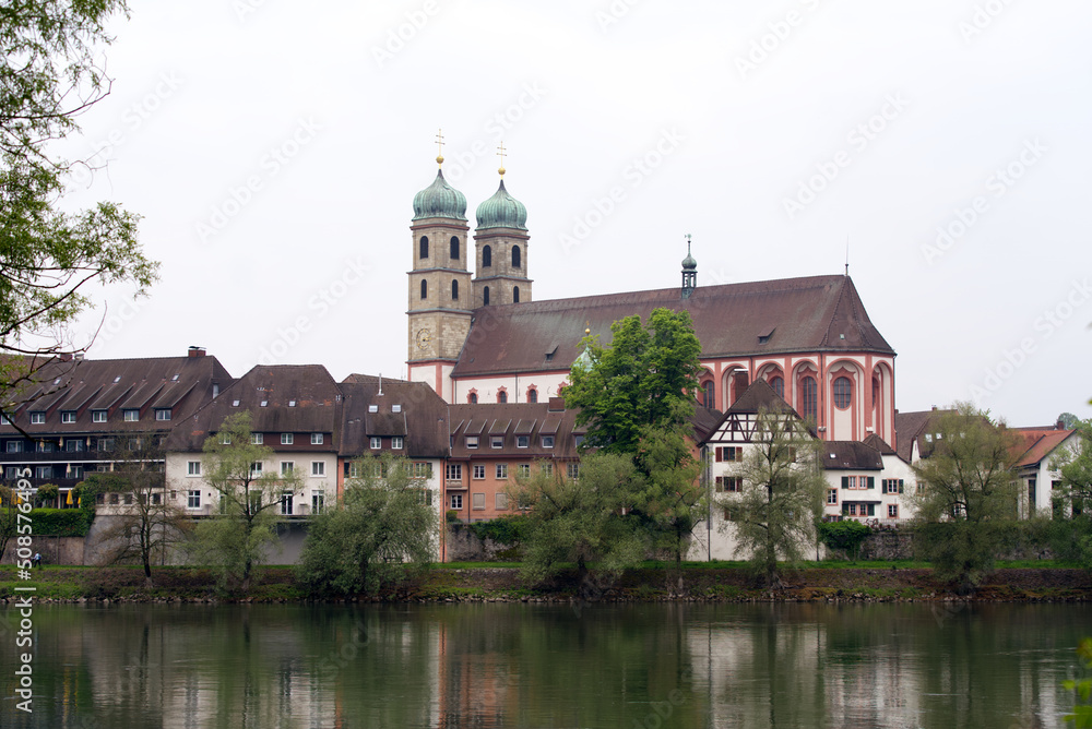 City of Bad Säckingen, Baden-Württemberg, with church and Rhine River on a cloudy spring day. Photo taken May 6th, 2022, Stein, Switzerland.