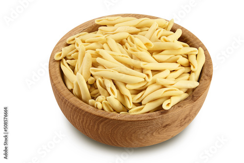 Typical Calabrian pasta called Maccheroncini or Maccheroni in wooden bowl isolated on white background with full depth of field. photo