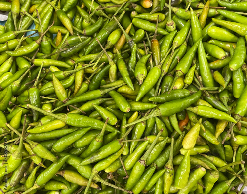 Large crop of green hot chili peppers