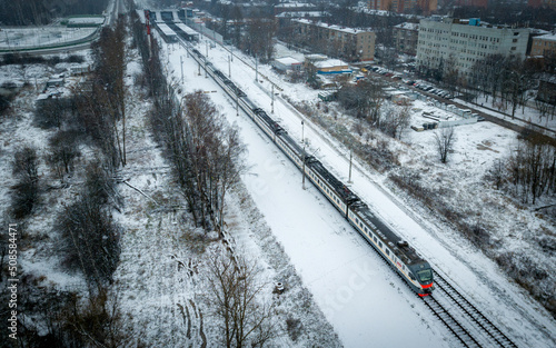 Train at snowy winter (aerial drone photo). Suburbs of Moscow, Russia