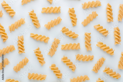 Pattern made of pasta on pastel background. Flat lay.