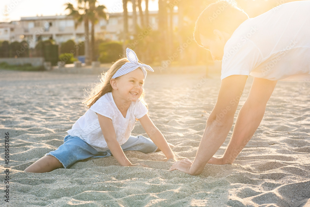 Father and daughter in summer on beach. Summer Weekend travel with dad. Happy family. playing and having fun Father and daughter in summer on beach. Summer Weekend travel with dad. Happy family. playing and having fun