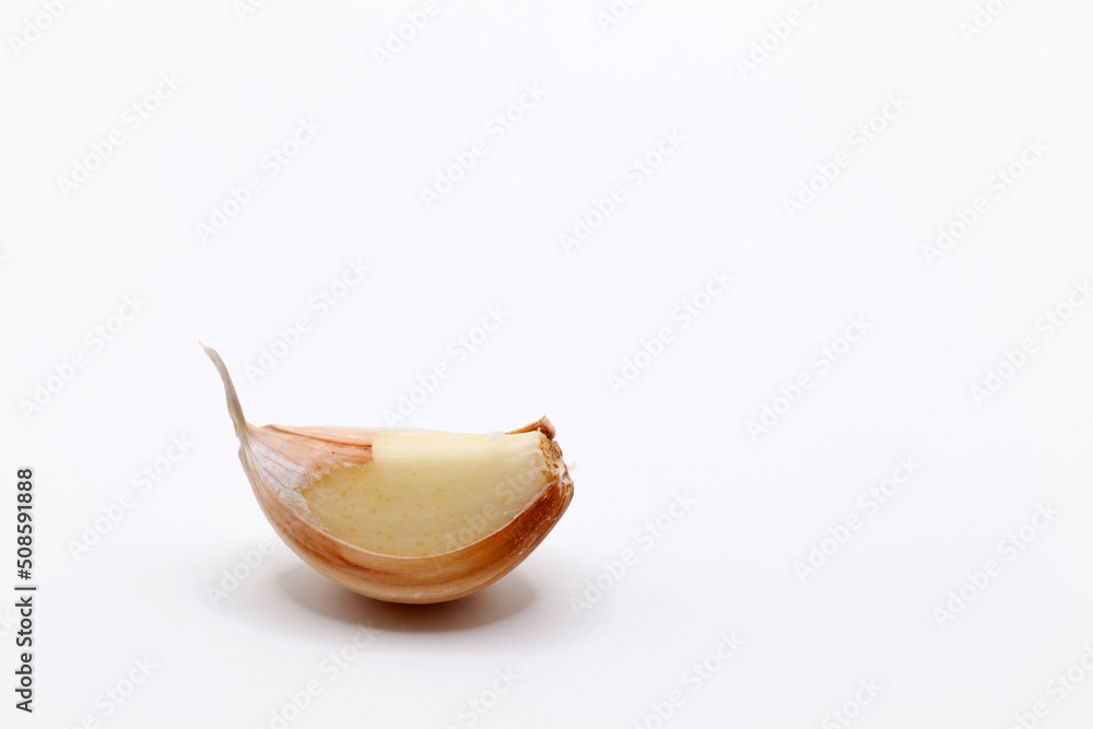 a clove of garlic on a white background a clove of garlic on a white background
