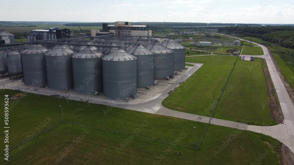 long rows of huge white gas tanks connected with pipeline system at refinery plant on sunny day aerial view long rows of huge white gas tanks connected with pipeline system at refinery plant on sunny day aerial view