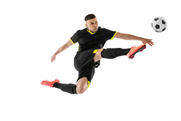 Dynamic portrait of professional male football soccer player training isolated on white studio background. Concept of sport, goals, competition, hobby, achievements