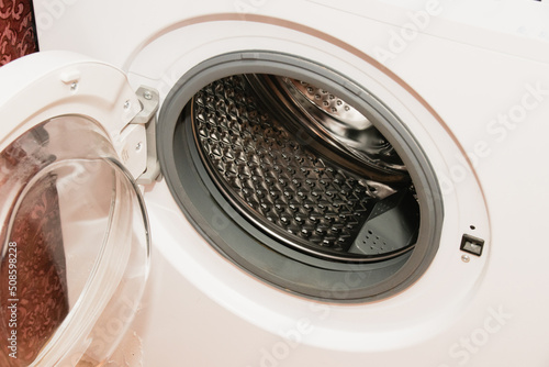 White washing machine, drum washing machine close up