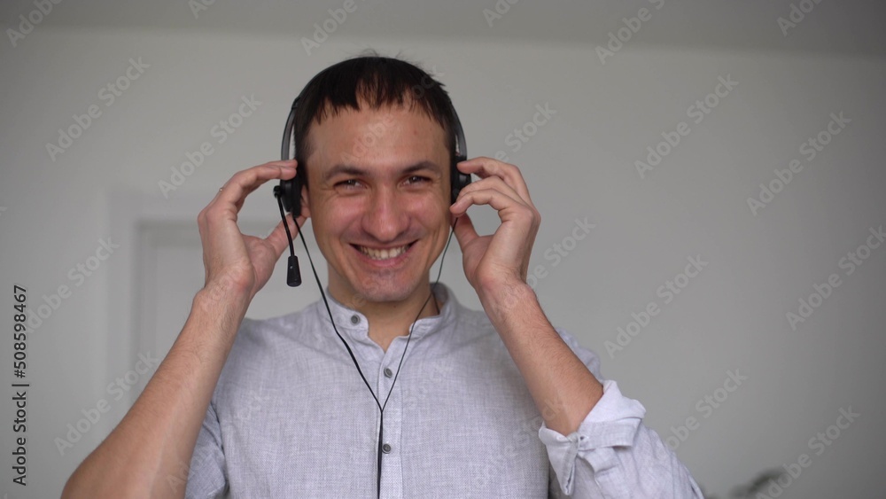 Smiling young adult man vlogger look at camera talk make live video conference call online chat using computer app recording blog vlog at home, close up webcam view, videochat concept Smiling young adult man vlogger look at camera talk make live video conference call online chat using computer app recording blog vlog at home, close up webcam view, videochat concept