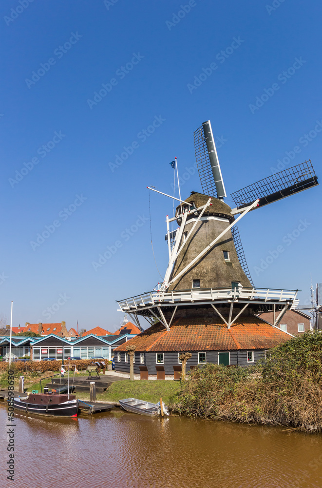 Historic windmill at the water in Meppel, Netherlands