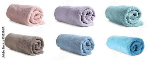 Set of rolled colorful towels on white background. Banner design