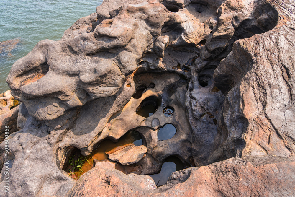 The stone slabs in the dry creek are broken. It is a slit hole because of the long erosion force of natural currents. The stone slabs in the dry creek are broken. It is a slit hole because of the long erosion force of natural currents.