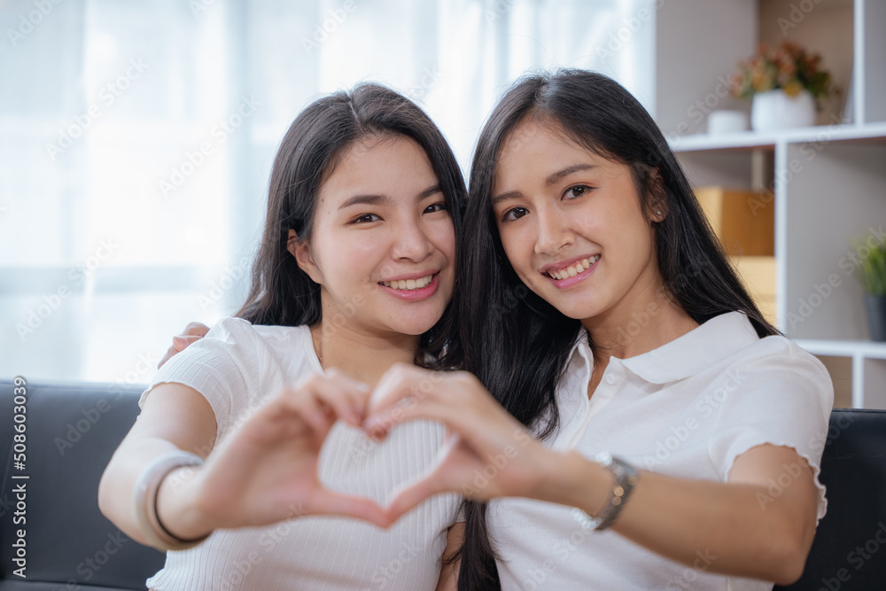 Two beautiful lesbian are hugging with women love and show the heart. lover is no genders. LGBTQ and lesbian concept. Two beautiful lesbian are hugging with women love and show the heart. lover is no genders. LGBTQ and lesbian concept.