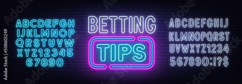 Betting tips neon sign on a brick background.