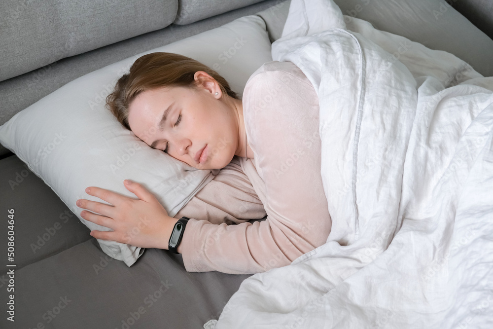 Woman sleeping in bed. Circadian rhythm optimization. Fight insomnia.Recovery of health in a dream. Woman sleeping in bed. Circadian rhythm optimization. Fight insomnia.Recovery of health in a dream.