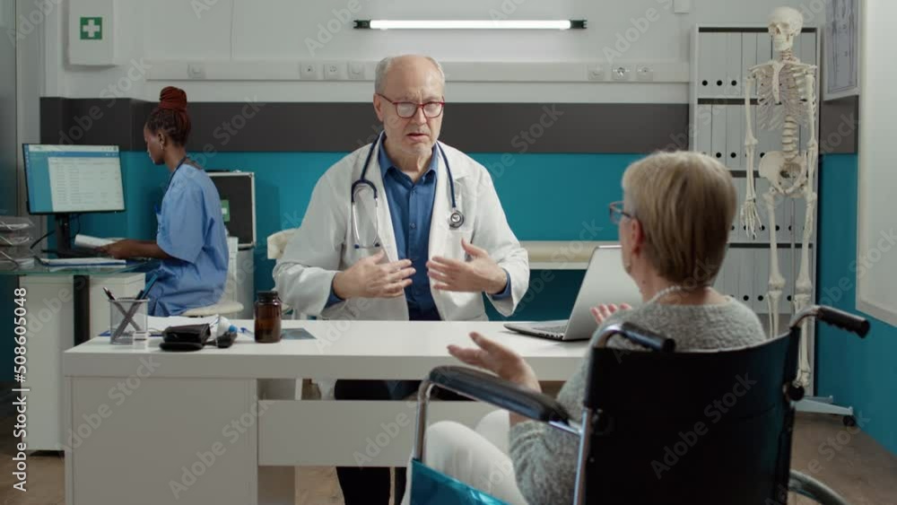 General practitioner consulting woman with chronic disability in medical office, doing checkup examination with medication. Retired patient with impairment and health condition at appointment. General practitioner consulting woman with chronic disability in medical office, doing checkup examination with medication. Retired patient with impairment and health condition at appointment.