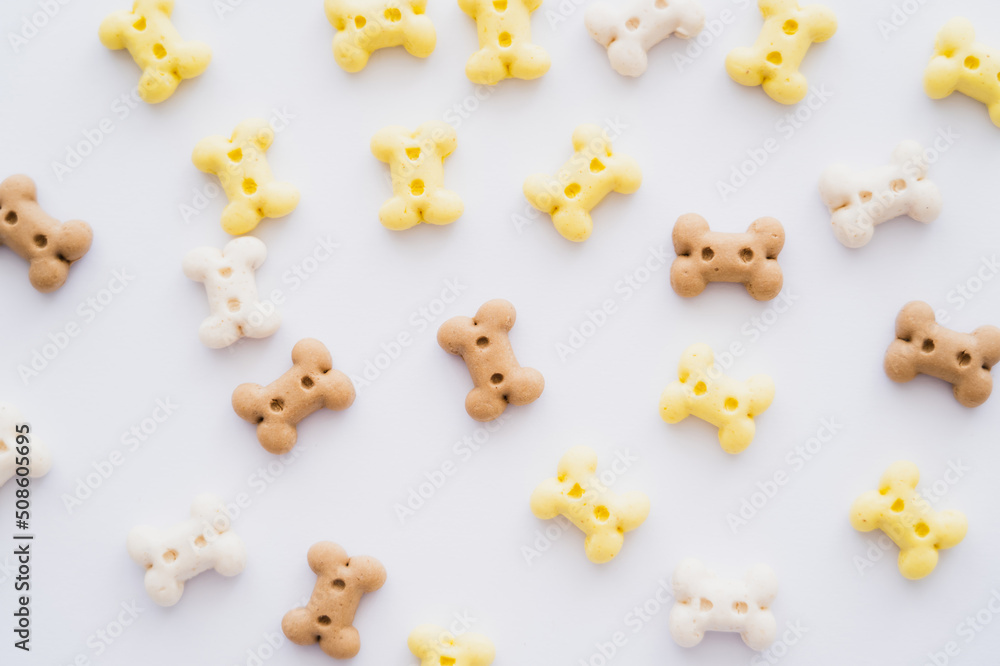 Obraz premium top view of bone shaped cookies for pet isolated on white.