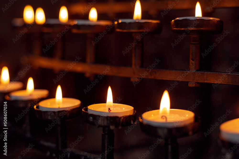 Lit candles in the church Lit candles in the church