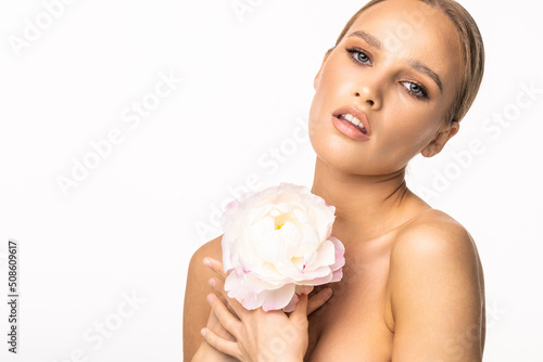Young beautiful woman relaxing with lotus flower at spa isolated on white background  professional beauty makeup