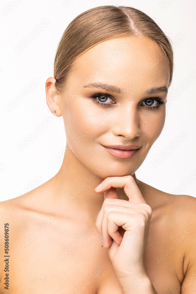 Beautiful young girl with a light natural make-up and perfect skin. Beauty face. on a white background. Beautiful young girl with a light natural make-up and perfect skin. Beauty face. on a white background.