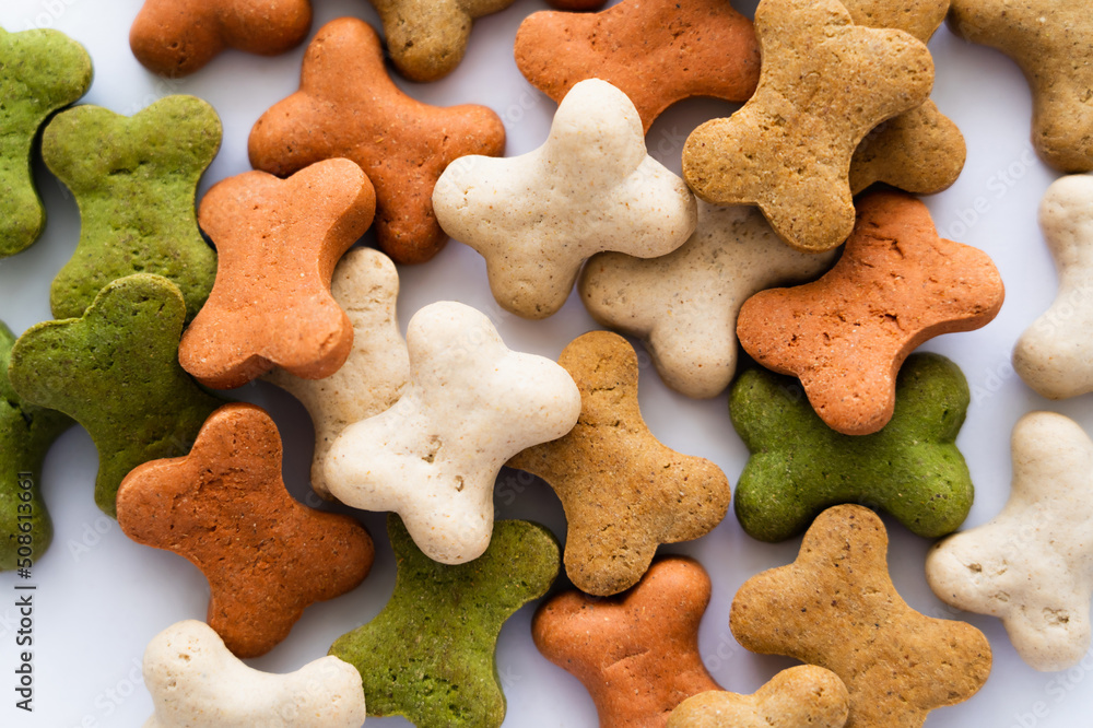 close up view of crunchy bone shaped cookies for dog. close up view of crunchy bone shaped cookies for dog.