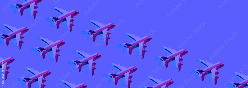 Banner with pattern made of passenger plane toy neon light. Minimalistic concept of air travel, business travel