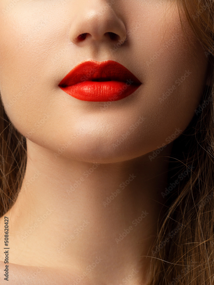 Fototapeta premium Sexual full lips. Natural gloss of lips and woman's skin. The mouth is closed. Increase in lips, cosmetology. Natural lips. Great summer mood with open eyes. fashion jewelry. Pink lip gloss