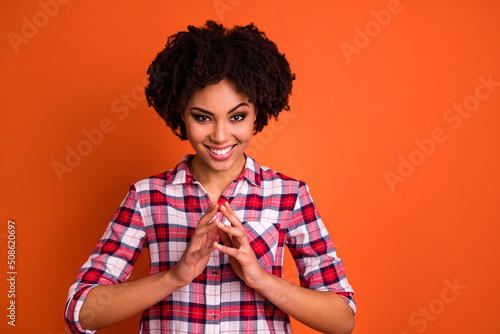Vászonkép Photo of cheerful pretty lady touch arms fingers brainstorming isolated on orang