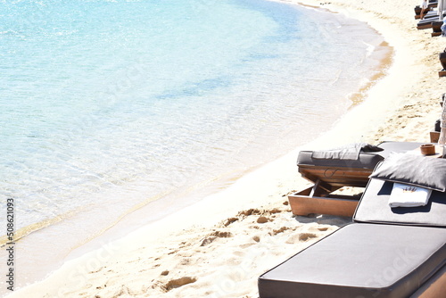 paradise relaxing life coast line puddling water Maserati towel brown mattress wood recline frame  photo
