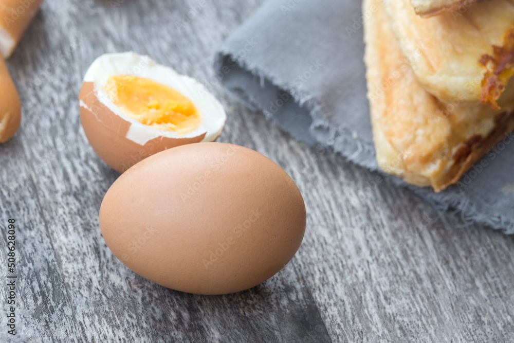 Eggs and Sandwich placed on wooden boards. This can be used as a business card background and can be used as an advertising image. Eggs and Sandwich placed on wooden boards. This can be used as a business card background and can be used as an advertising image.