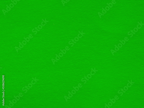 Textured bright green paper texture