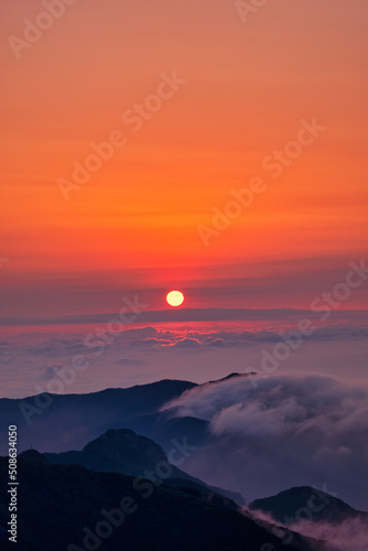 Scenic view of mountains against sky during sunrise