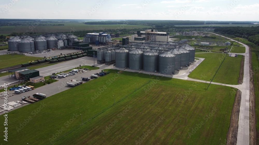 long rows of huge white gas tanks connected with pipeline system at refinery plant on sunny day aerial view long rows of huge white gas tanks connected with pipeline system at refinery plant on sunny day aerial view