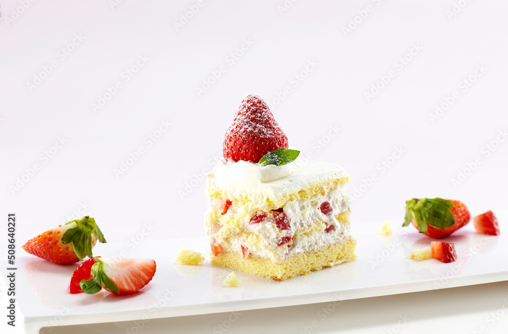 Fresh delicious strawberry cake on white background