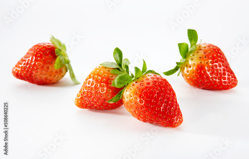 Closeup of fresh strawberries on white background