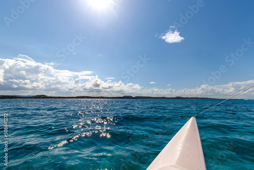 Beautiful landscape from the catamaran to Atlantic ocean and coastline, Turquoise water and blue sky with clouds. Cuba