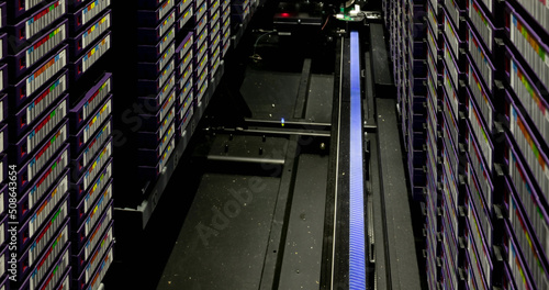 Image of empty corridor with rows of computer servers