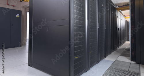 Image of empty corridor with rows of computer servers