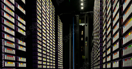 Image of empty corridor with rows of computer servers