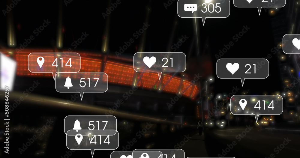Image of social media icons and numbers over road traffic and city at night
