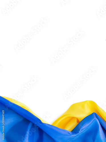 National flag of Ukraine. Fabric curved in yellow-blue colors ribbons on white background. National symbol of country. Europe. Copy space. photo