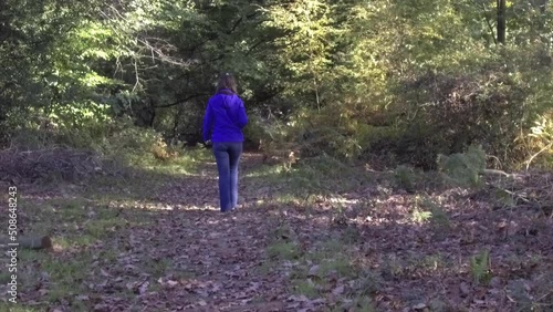 Young girl walking in Savernake Forest - England photo